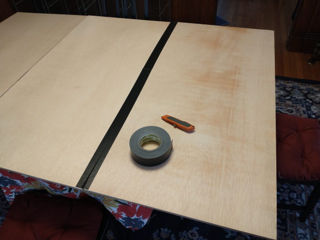 Two boards taped together.