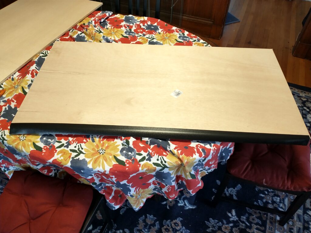 Two boards back-to-back with a tape hinge over the edges.