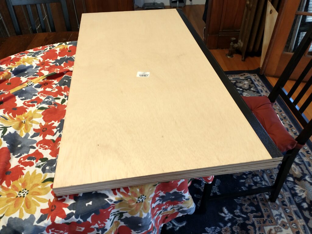 All three boards folded atop each other ready for storage.
