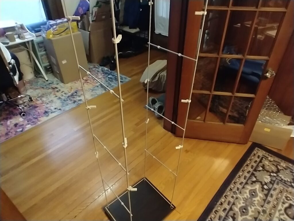 A partially assembled IKEA DETOLF case showing the placement of add-on 3d printed shelf brackets.