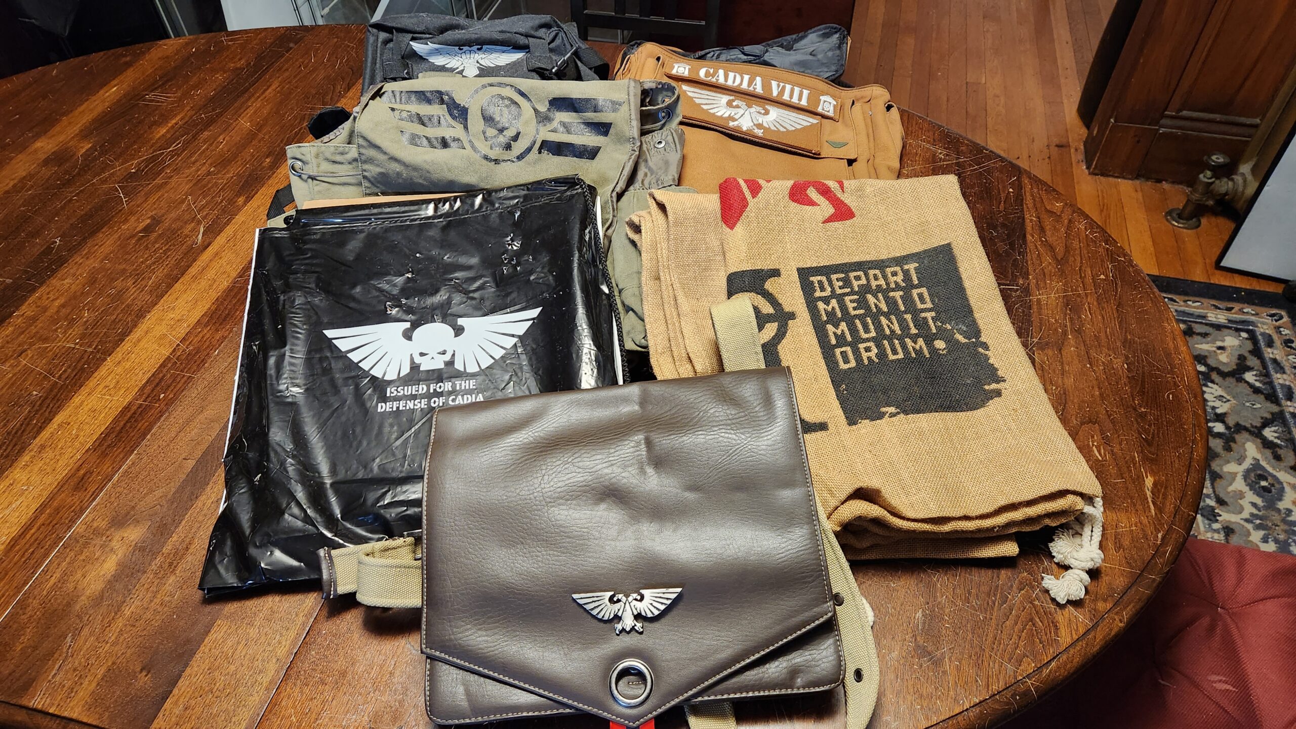 Various Games Workshop Warhammer 40K prop bags and backpacks.