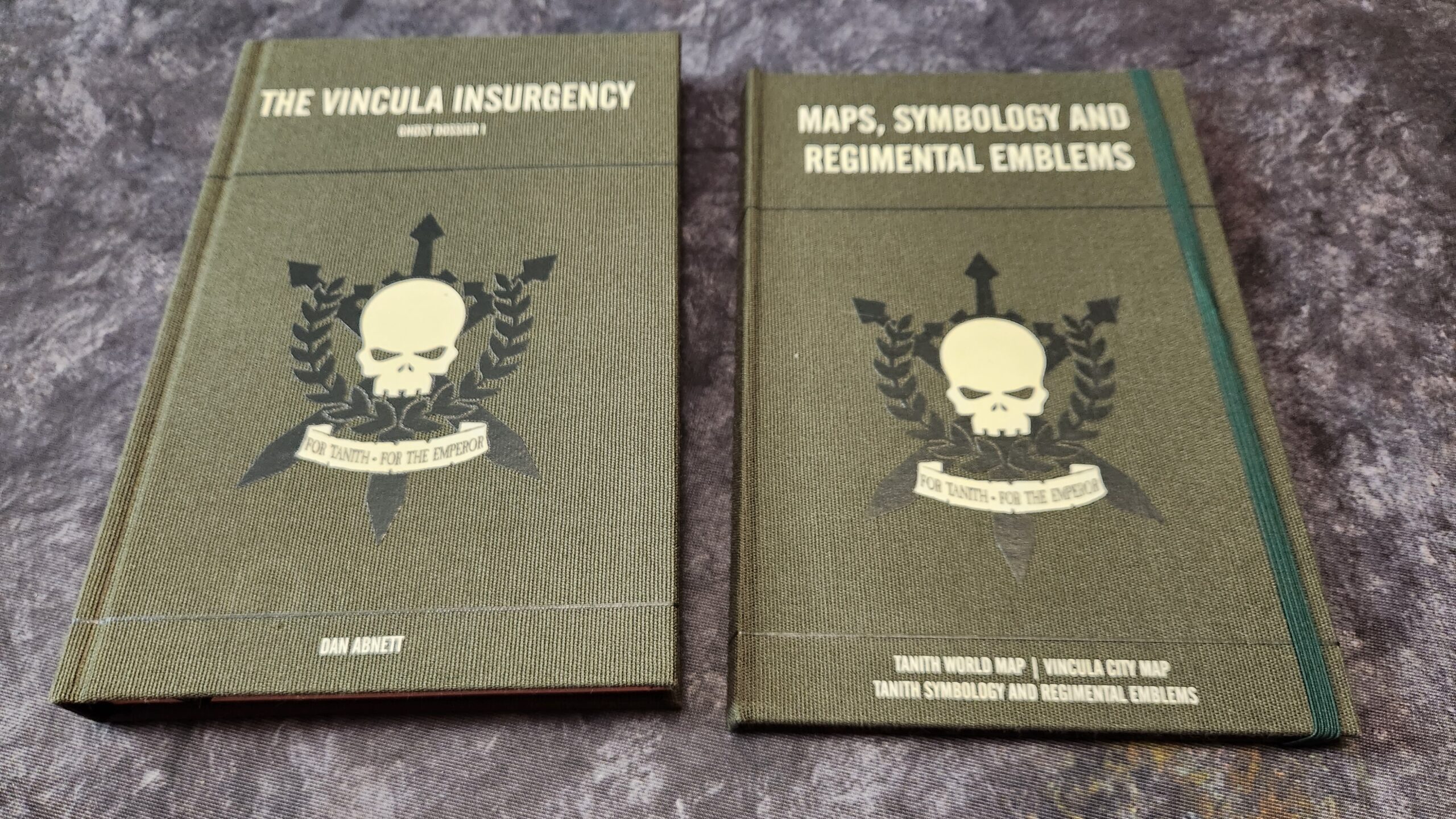A picture of two books The Vincula Insurgency and Maps, Symbology, and Regimental Emblems.
